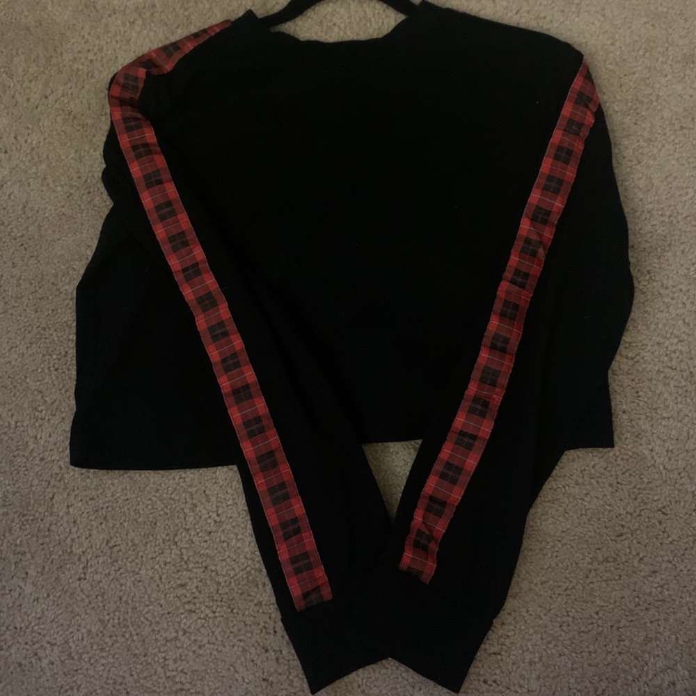 Black top with red plaid detail